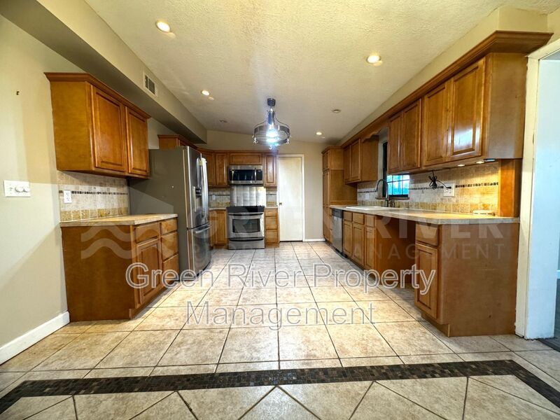Poolside Living in Style!!  Renovated 4BR Home with Open Floor Plan & Pet-Friendly Perks! property image