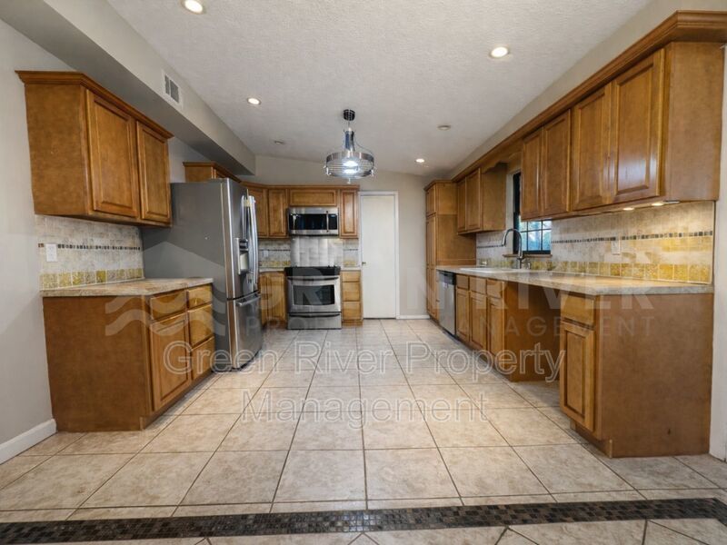Poolside Living in Style!!  Renovated 4BR Home with Open Floor Plan & Pet-Friendly Perks! property image