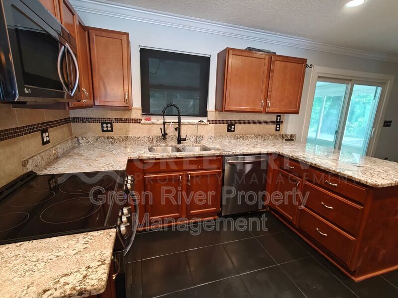 Stylish 4BR Home with Solar Panels, Florida Room & Outdoor Entertaining Space!! property image