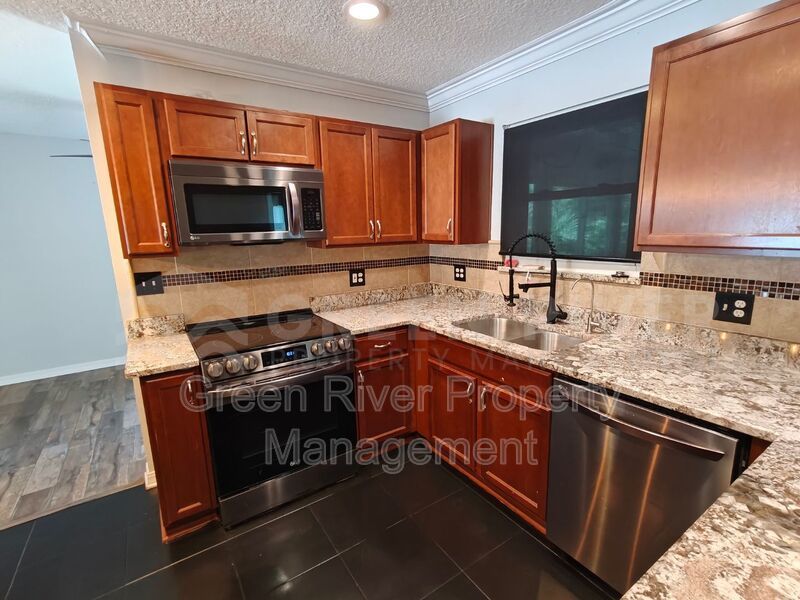Stylish 4BR Home with Solar Panels, Florida Room & Outdoor Entertaining Space!! property image