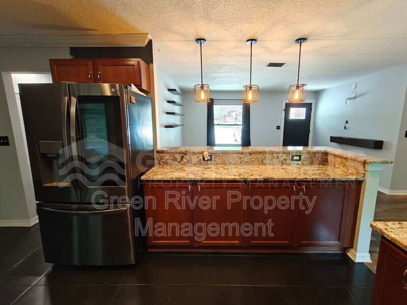 Stylish 4BR Home with Solar Panels, Florida Room & Outdoor Entertaining Space!! property image