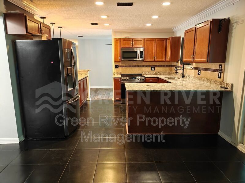 Stylish 4BR Home with Solar Panels, Florida Room & Outdoor Entertaining Space!! property image