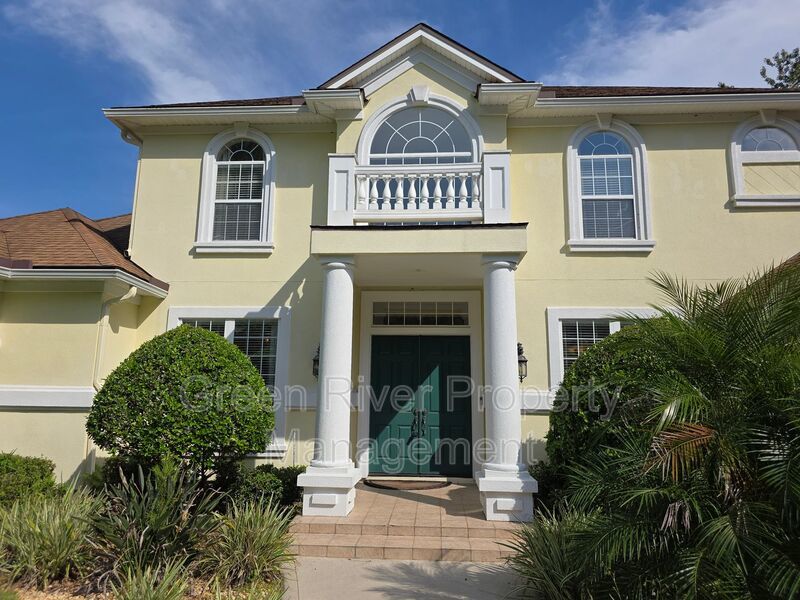Spacious 5BR/5BA Home with Screened Pool & Pond View in Eagle Harbor at Black Creek! property image