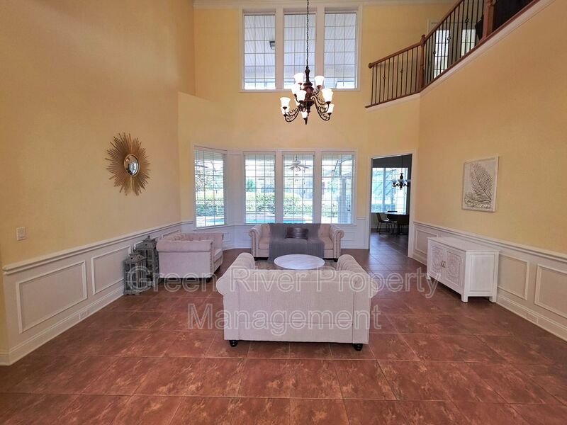 Spacious 5BR/5BA Home with Screened Pool & Pond View in Eagle Harbor at Black Creek! property image