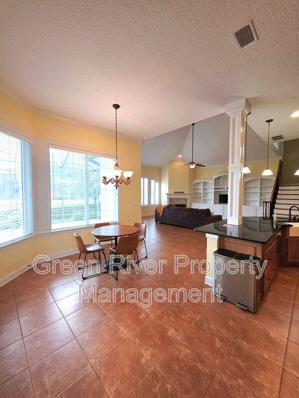 Spacious 5BR/5BA Home with Screened Pool & Pond View in Eagle Harbor at Black Creek! property image