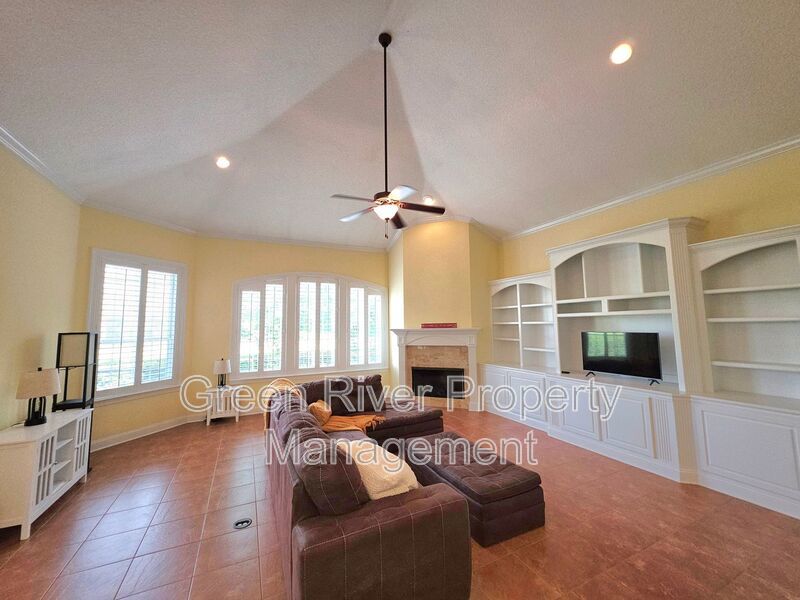 Spacious 5BR/5BA Home with Screened Pool & Pond View in Eagle Harbor at Black Creek! property image