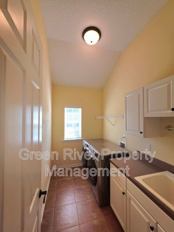 Spacious 5BR/5BA Home with Screened Pool & Pond View in Eagle Harbor at Black Creek! property image