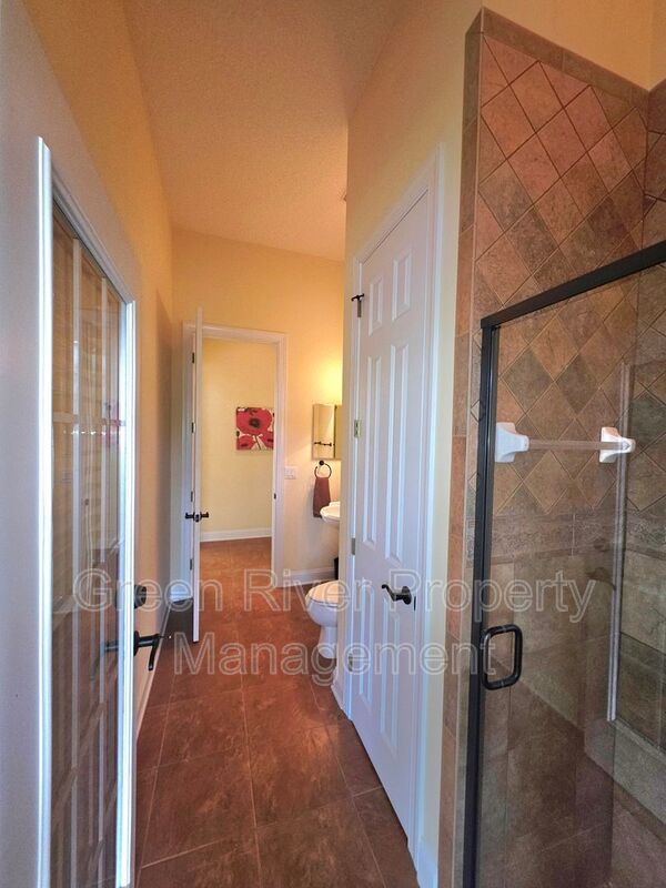Spacious 5BR/5BA Home with Screened Pool & Pond View in Eagle Harbor at Black Creek! property image