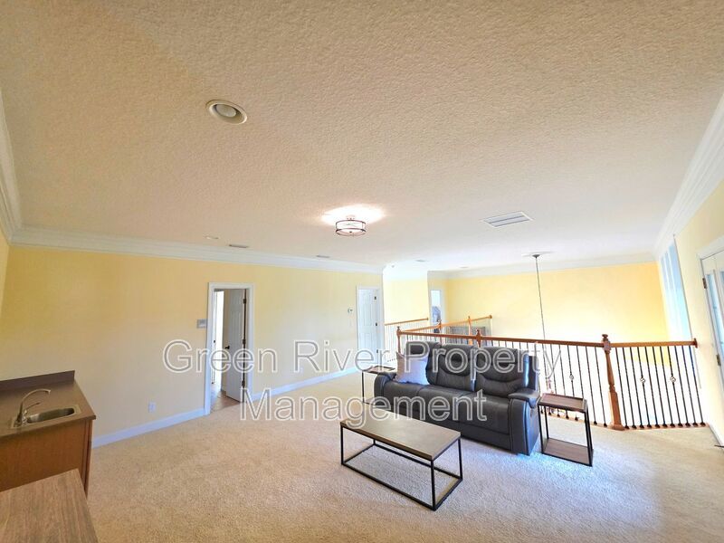 Spacious 5BR/5BA Home with Screened Pool & Pond View in Eagle Harbor at Black Creek! property image