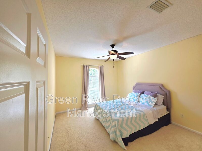 Spacious 5BR/5BA Home with Screened Pool & Pond View in Eagle Harbor at Black Creek! property image